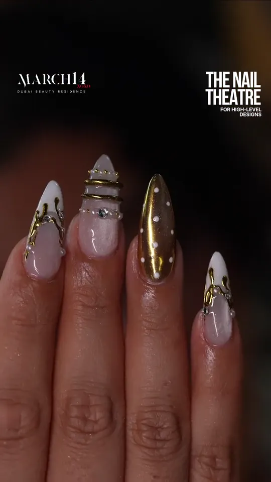 Gold chrome nail art with 3D details at March14 in Dubai