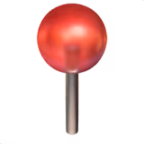 Chincheta redonda roja con cabeza brillante y cuerpo metálico.