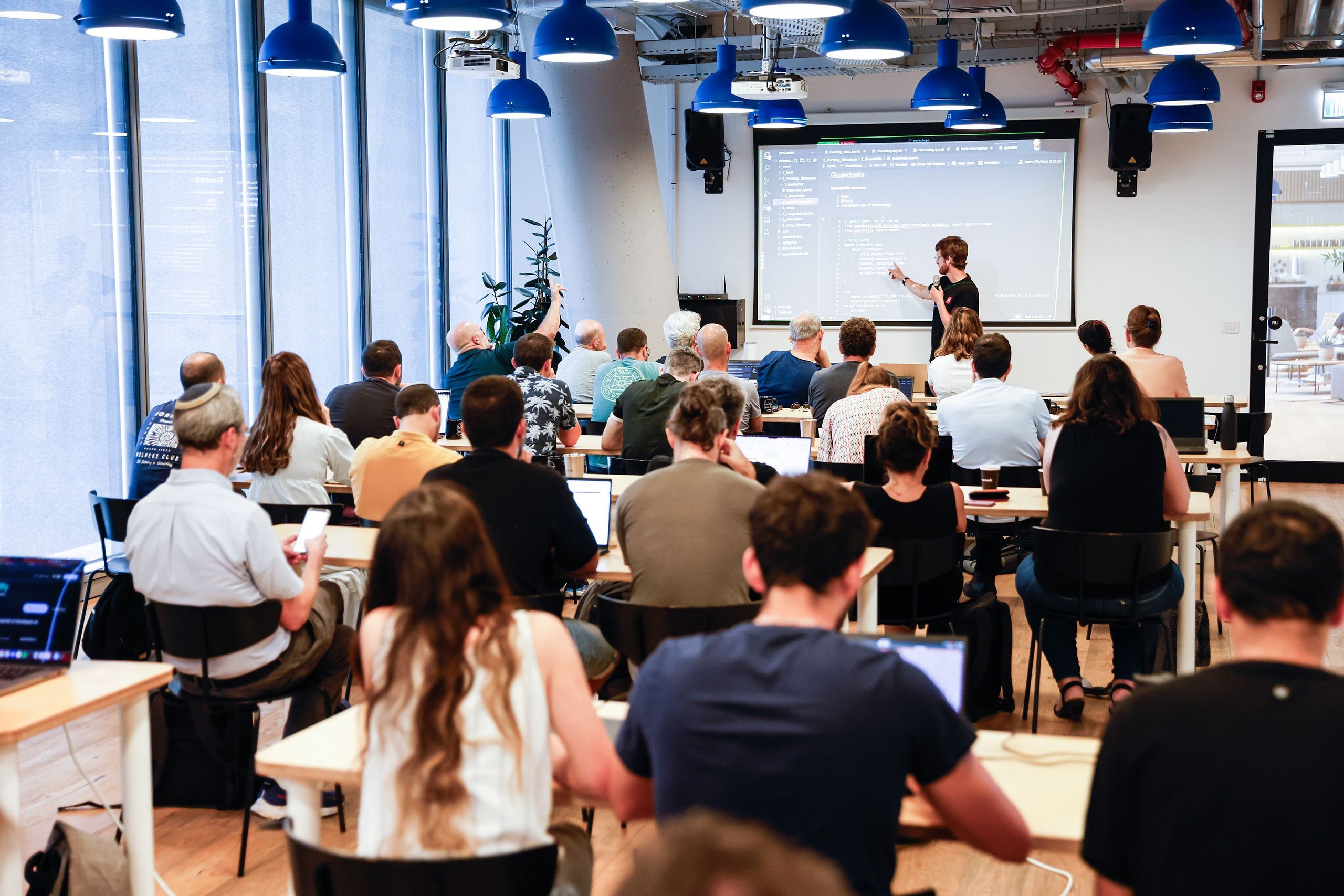 AI workshop session with participants in a lecture hall