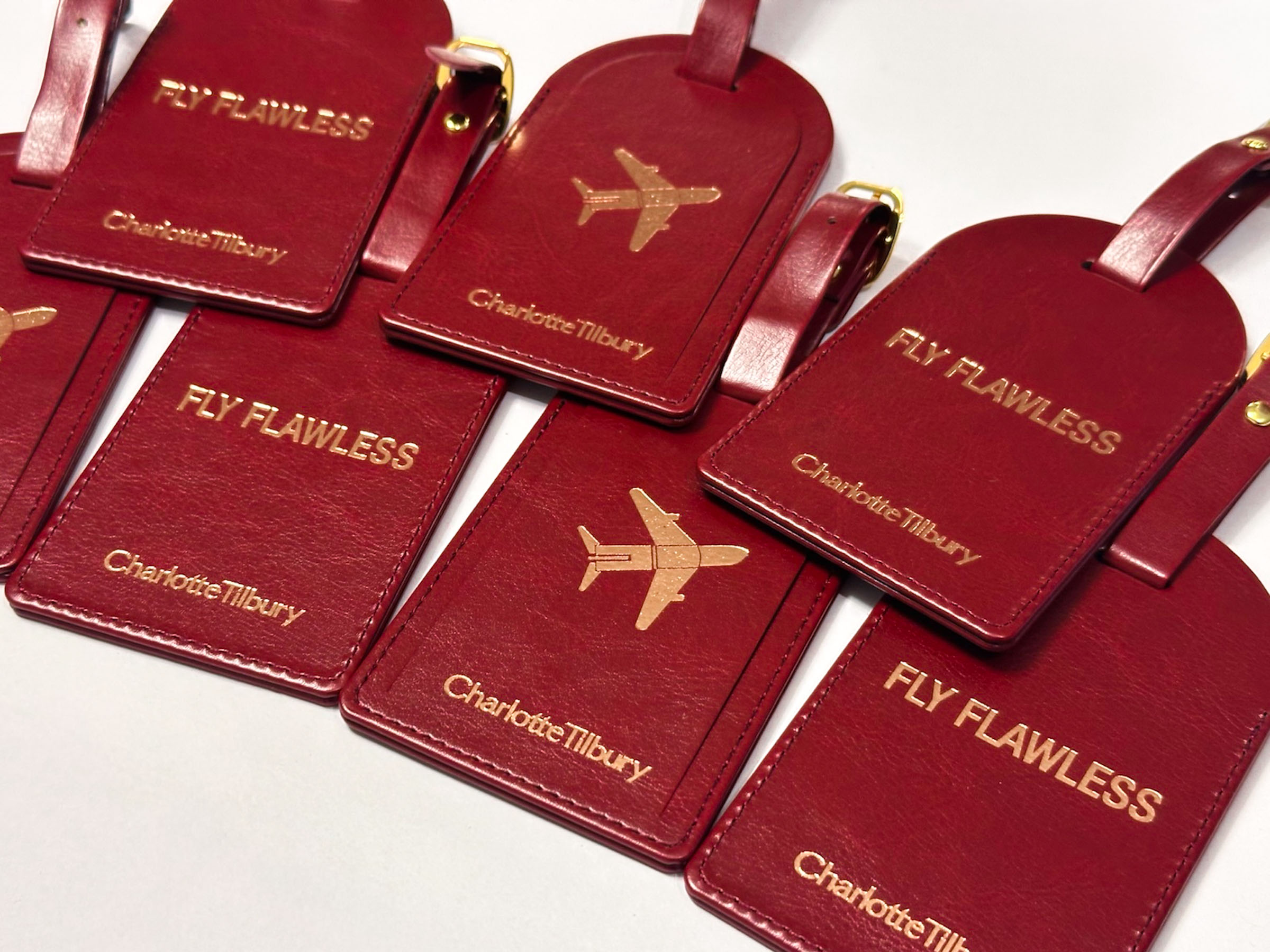 Foiled and debossed leather tags for Charlotte Tilbury