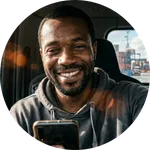 Friendly selfie of a professional truck driver in Hamburg harbor.