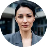 Welcoming smile from Elena R., a receptionist in Hamburg, placed by Express Jobs.
