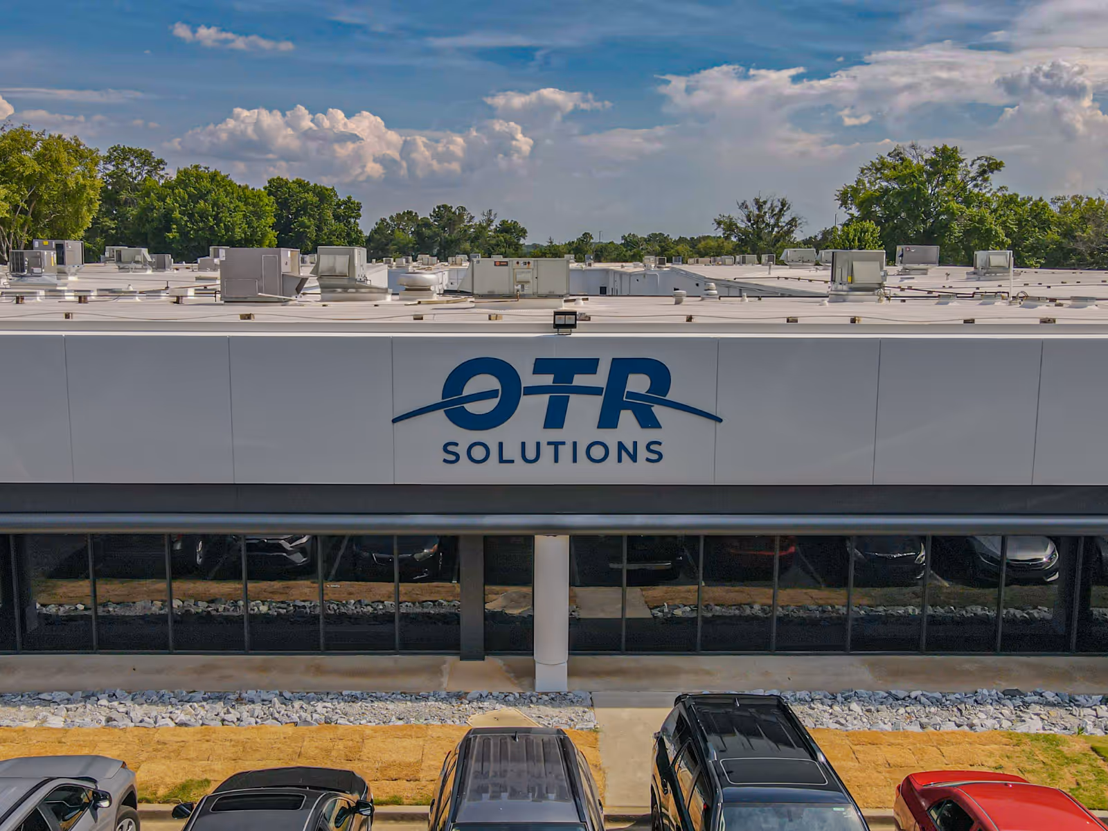 OTR Solutions sign on the exterior of an office building.
