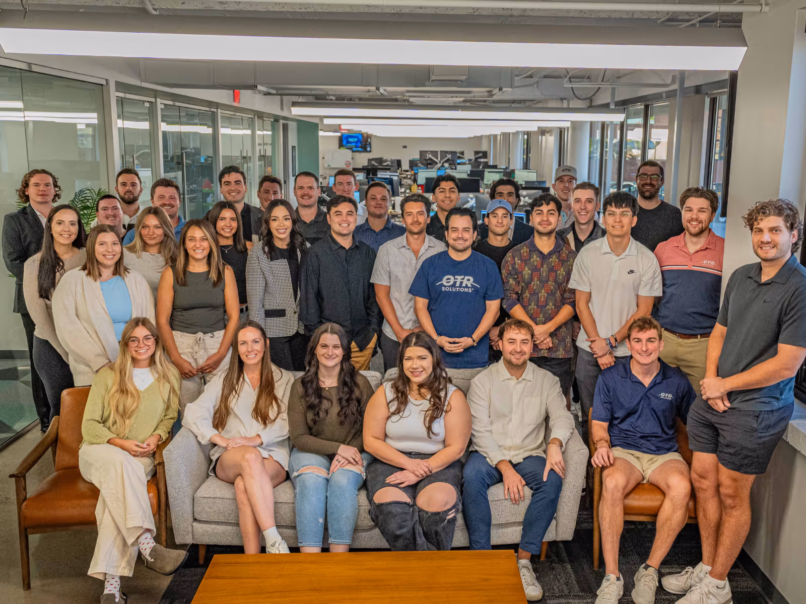 OTR Solutions team gathered in an office.