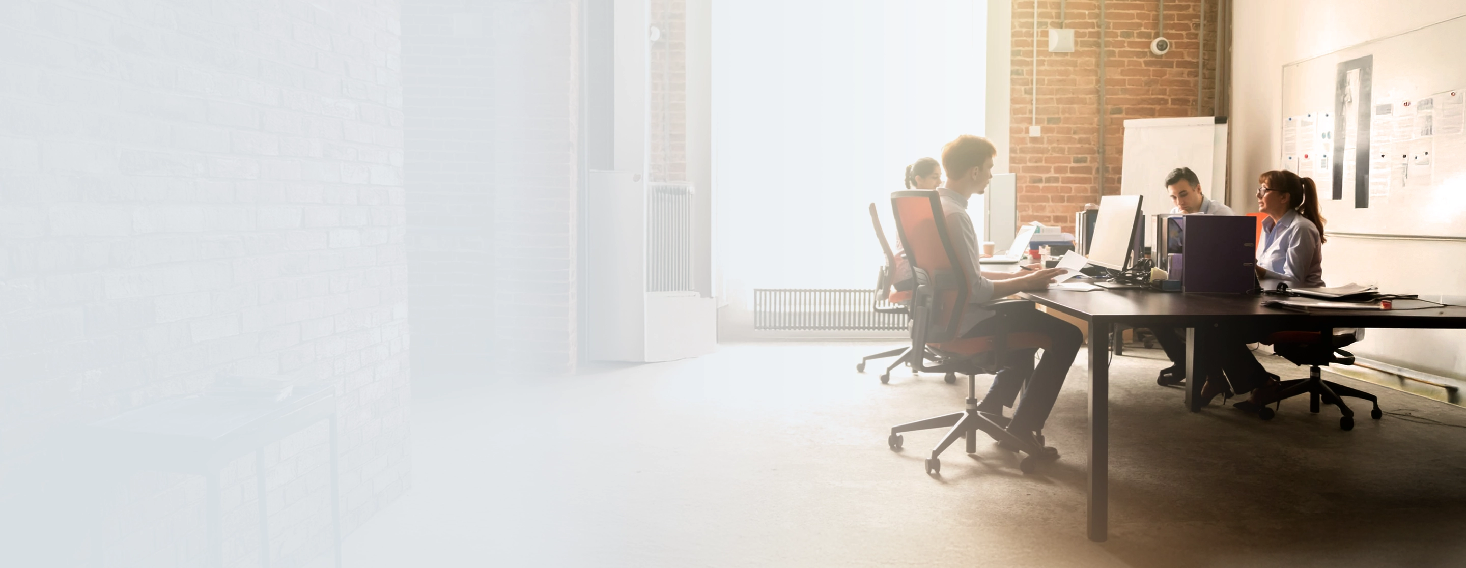 Team managing freight back office operations and billing workflows in a modern office setting
