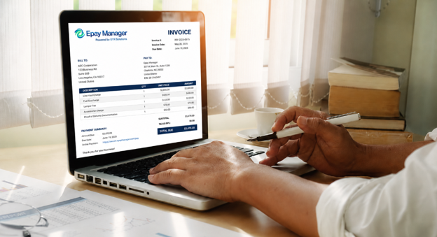 Freight broker reviewing a carrier invoice in the Epay Manager platform on a laptop screen.