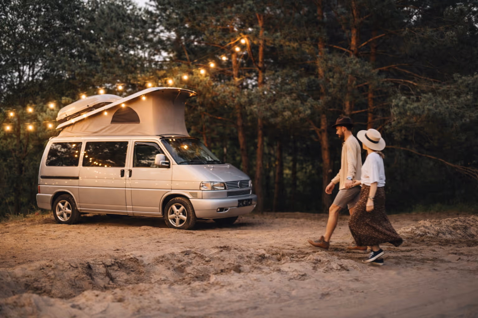 Campervan parked in forest campsite during vanlife trip