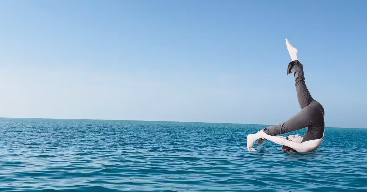 Woman practicing Pilates with the sea in the background at the Bat Galim 13 branch | Studio Naim Haifa