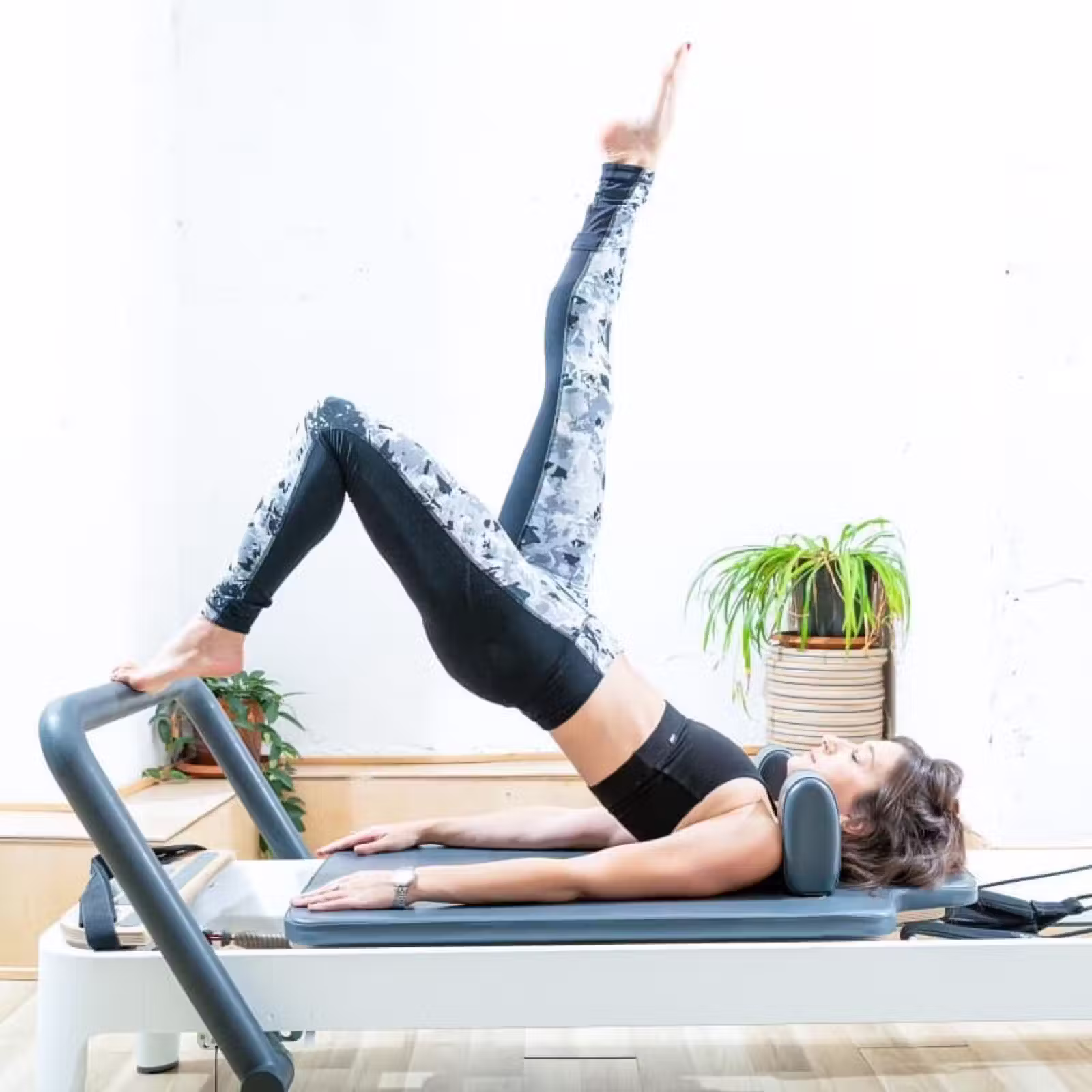 Woman practicing reformer Pilates at the Mendele 9 branch | Studio Naim Tel Aviv