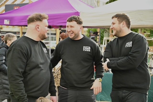 Thin pizza coming out from the oven