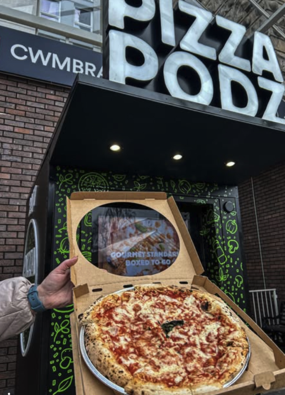Two girls eating pizza at a home party