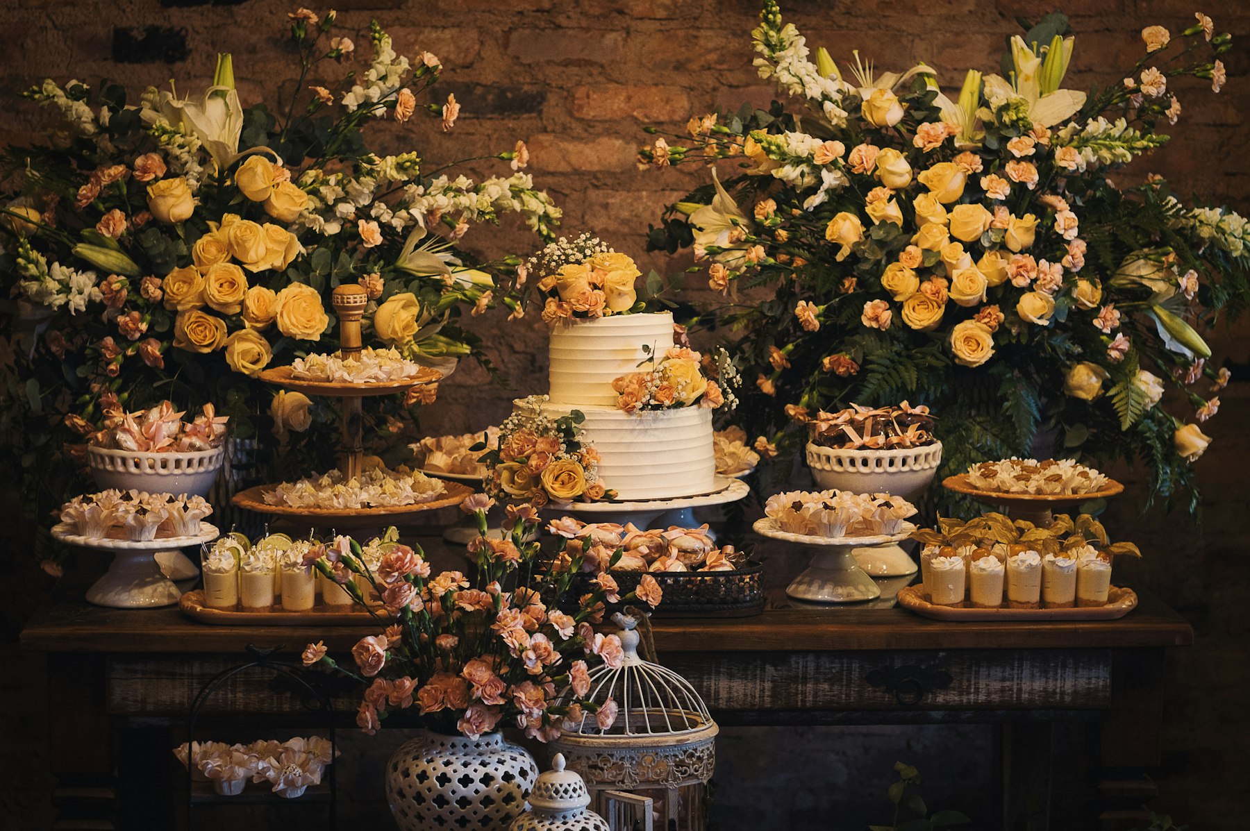 A wedding sweets table with cake and flowers in Rio de Janeiro