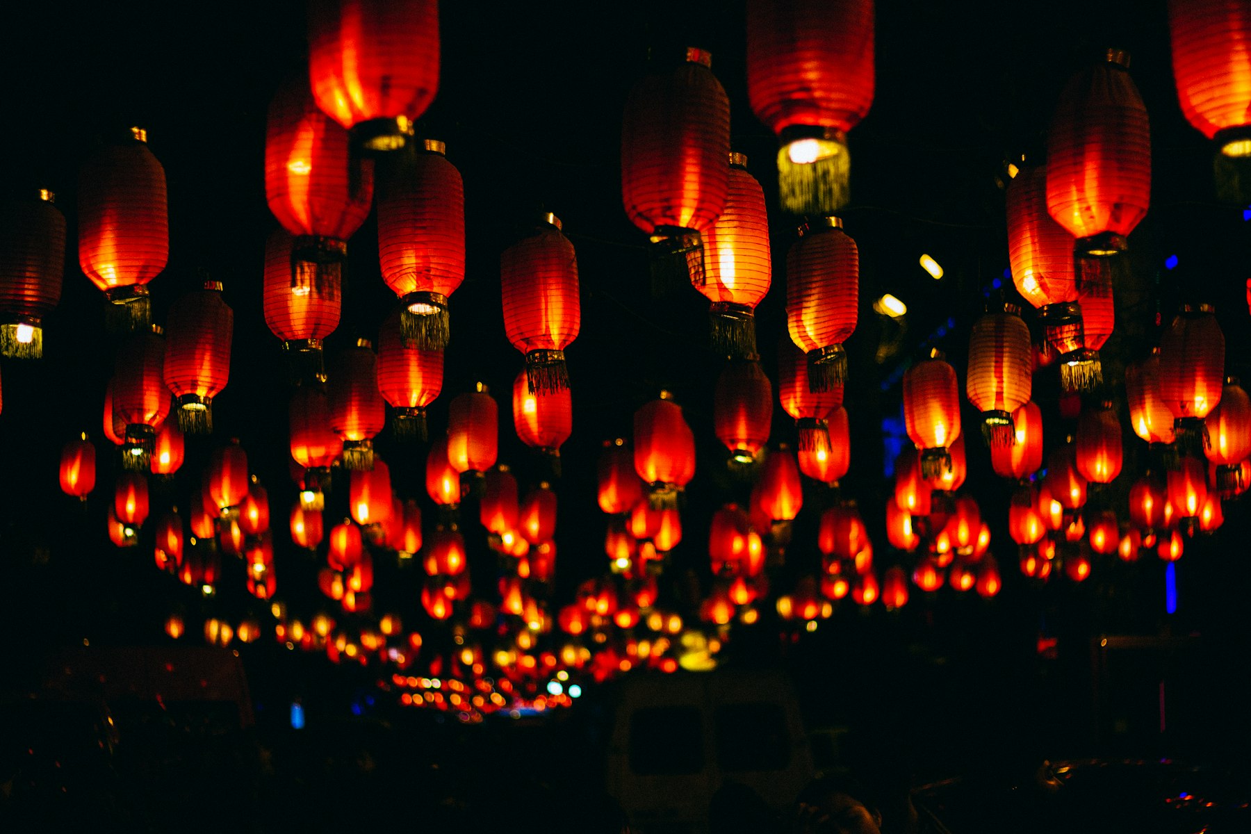 Rows of glowing red lanterns at night in Beijing