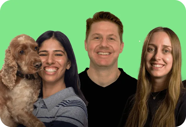 Three smiling adults, one holding a brown dog, against a green background.