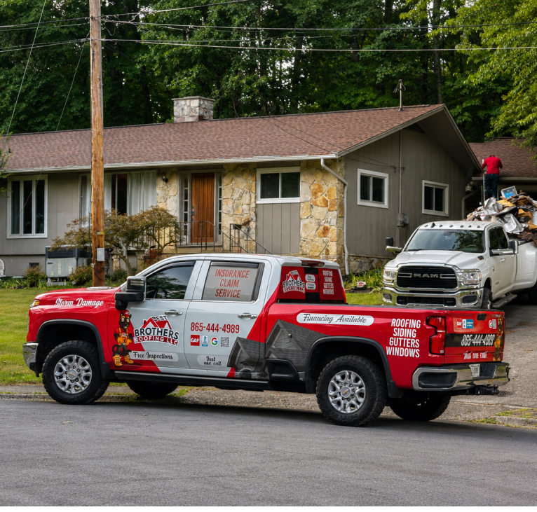 Professional roof inspector examining asphalt shingles up close to identify damage and assess roof condition