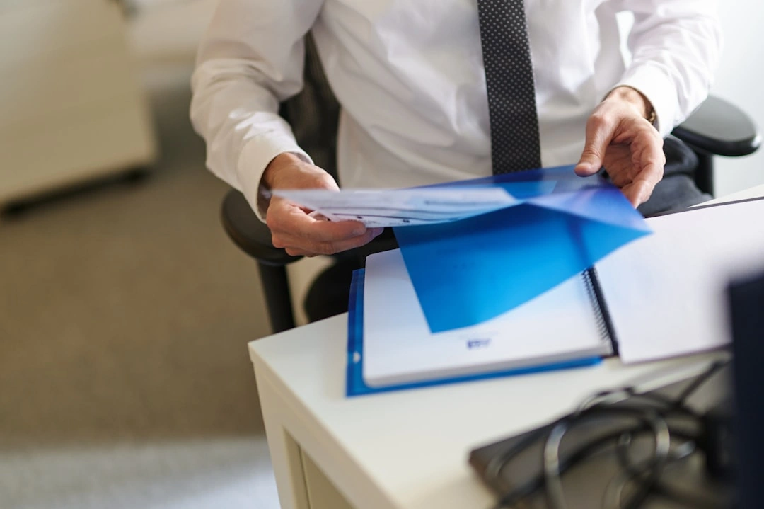 financial advisor reviewing insurance documents for risk assessment financial advisor reviewing insurance documents for risk assessment