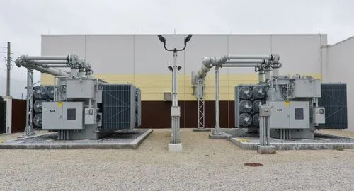 3D model of an airport terminal with glass walls, a control tower, airplane at the gate, and surrounding service vehicles.