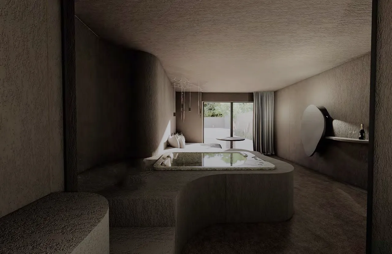 Chambre moderne avec jacuzzi encastré, canapé avec coussins, grande fenêtre avec rideau gris et miroir rond sur le mur.