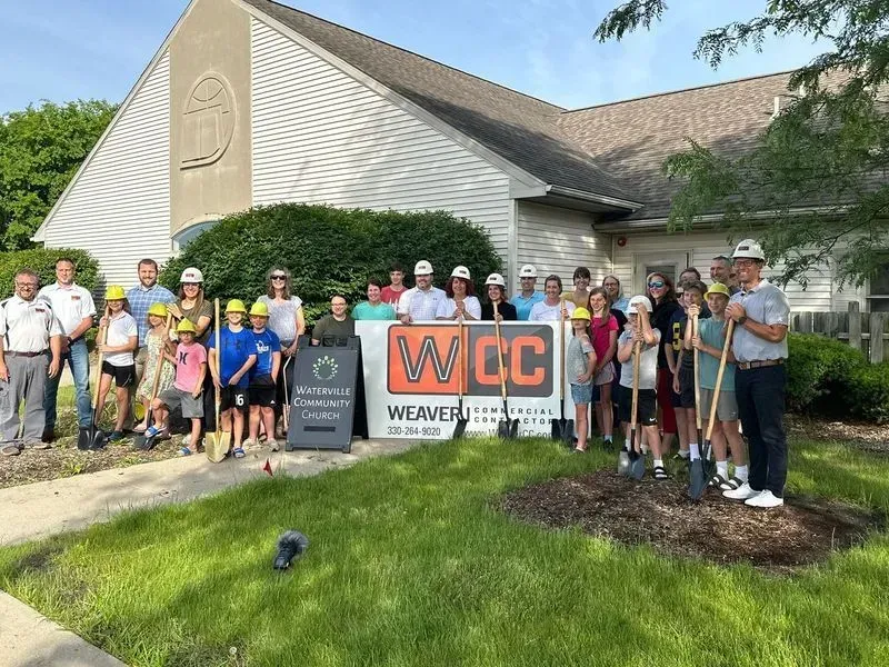 Waterville Community Church members and Weaver Commercial Contractor team gathered outside the church for a construction project groundbreaking.