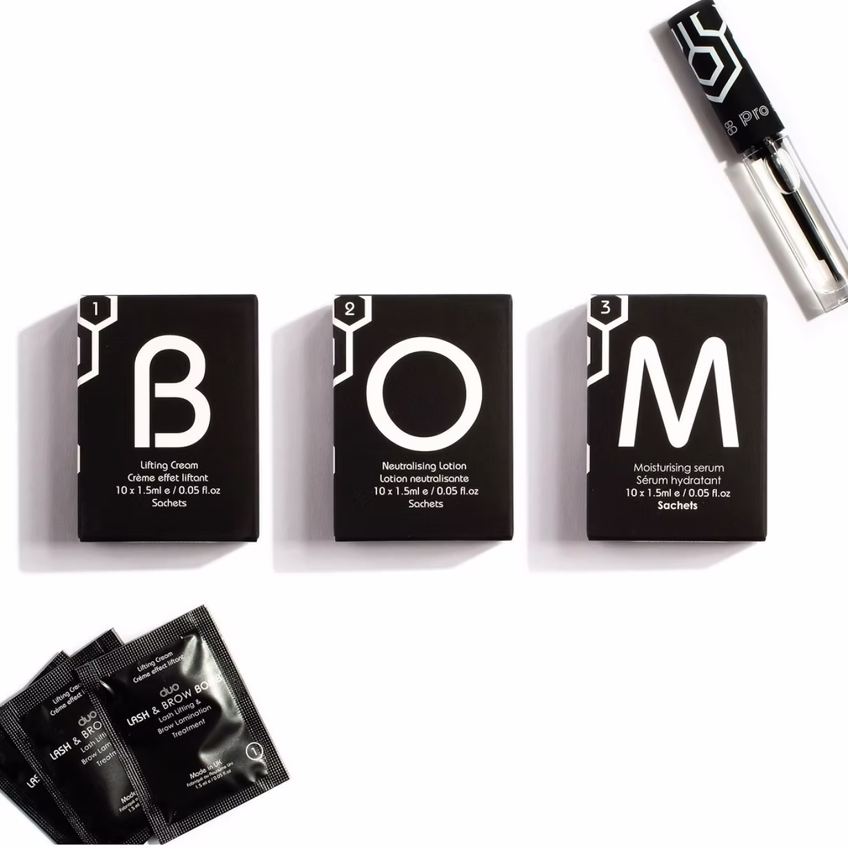 Set of three black skincare product boxes labeled B, O, and M.