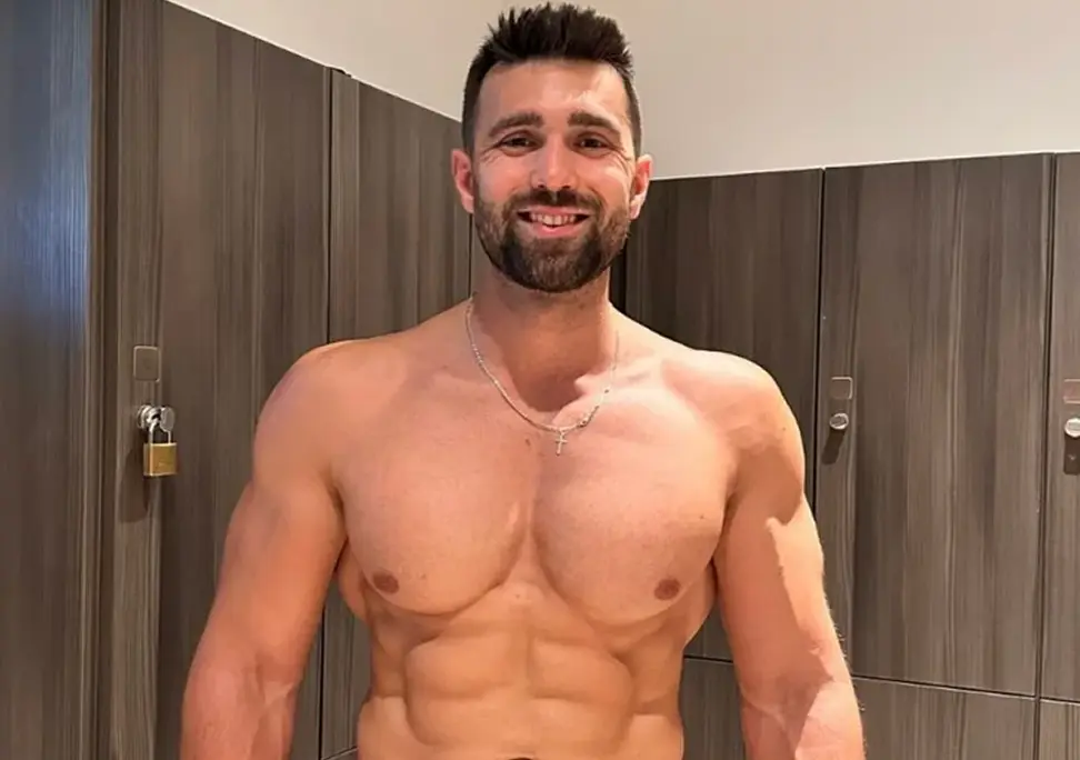 Fitness coach Josh showing muscular physique and results from years of training and coaching experience