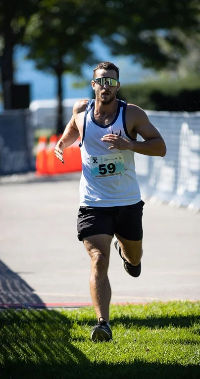 Fitness coach Kyle running in a race showing endurance training and an active lifestyle