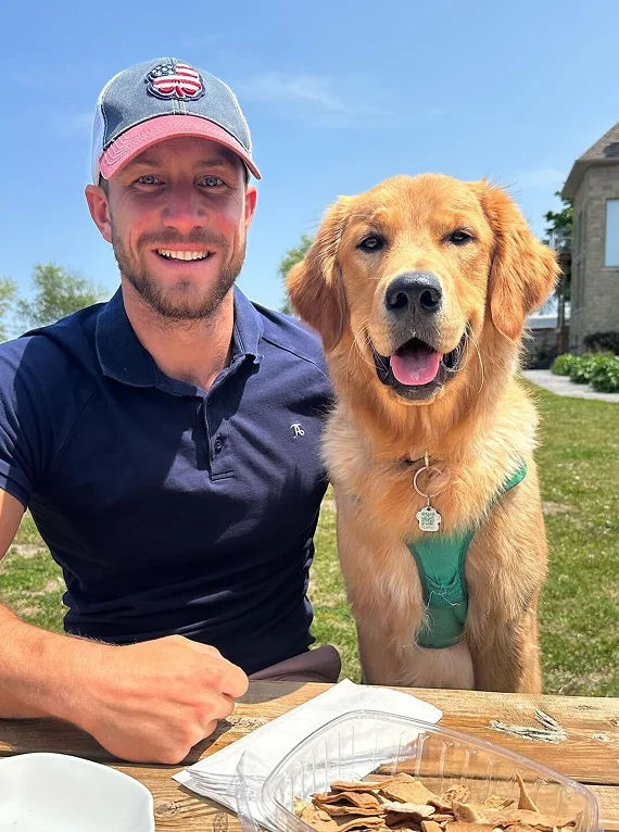 Fitness coach Kyle enjoying everyday life with his dog while maintaining a healthy lifestyle