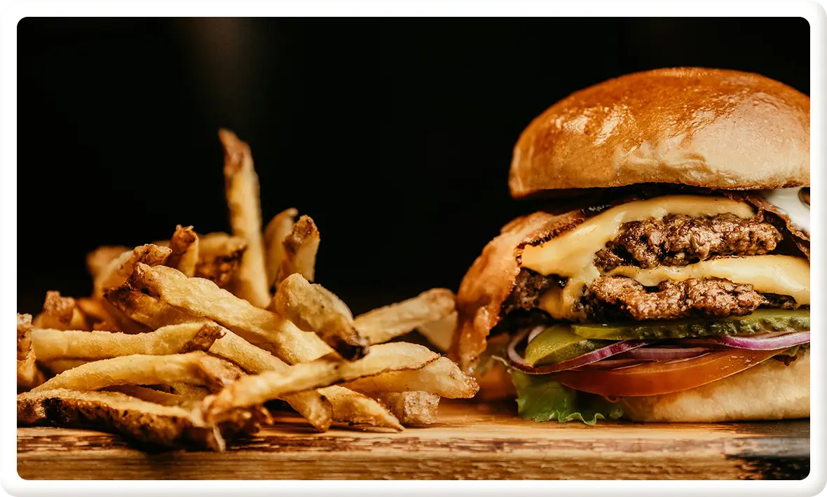 Burger and fries meal representing common fast food choices and high calorie options