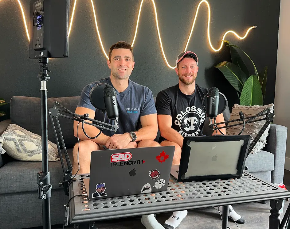 Colossus Fitness coaches recording podcast discussing training, nutrition, and real client results