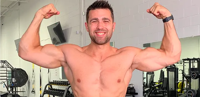 Josh flexing his physique at the gym