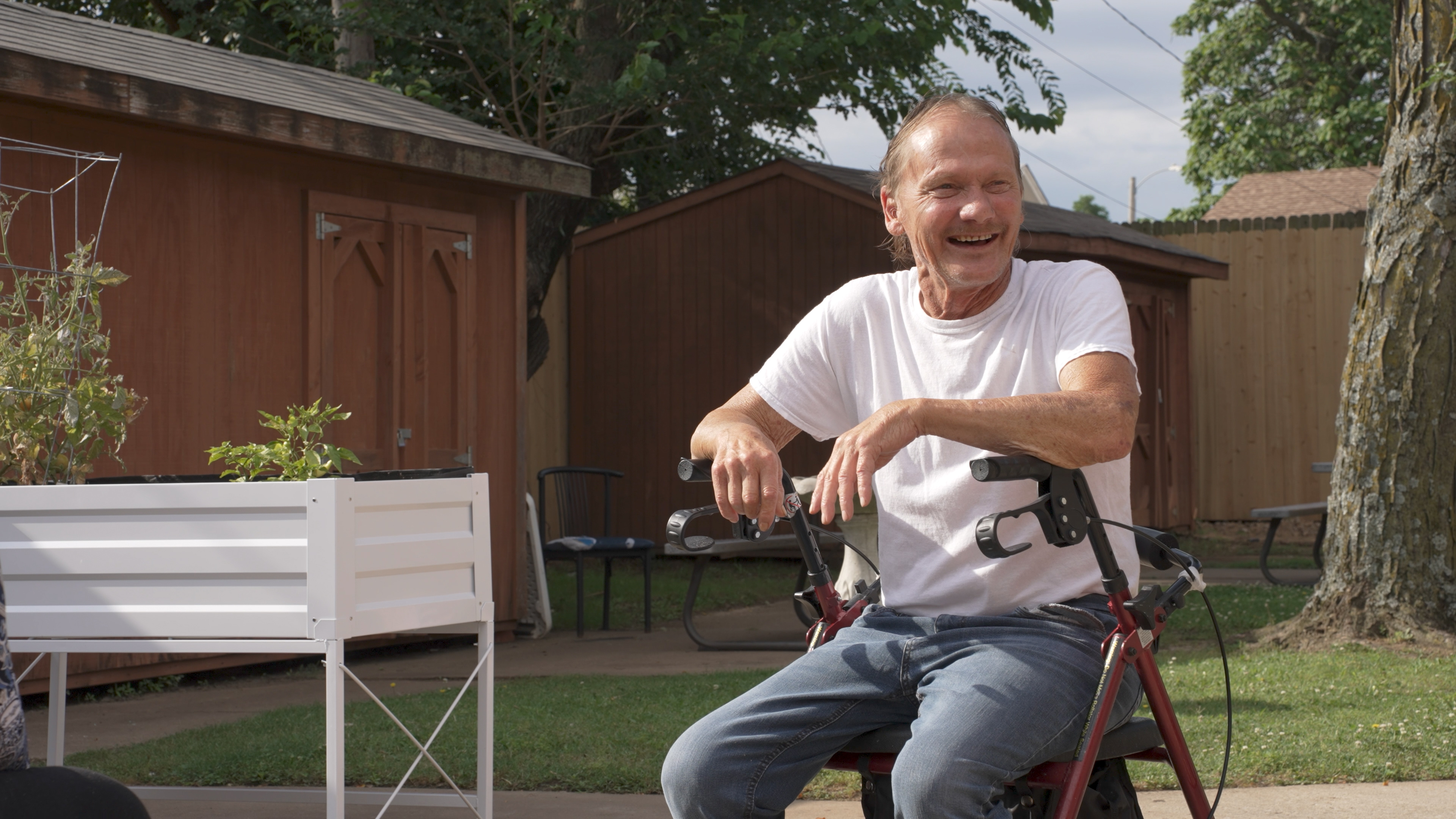 Lady dancing with a man in a wheelchair