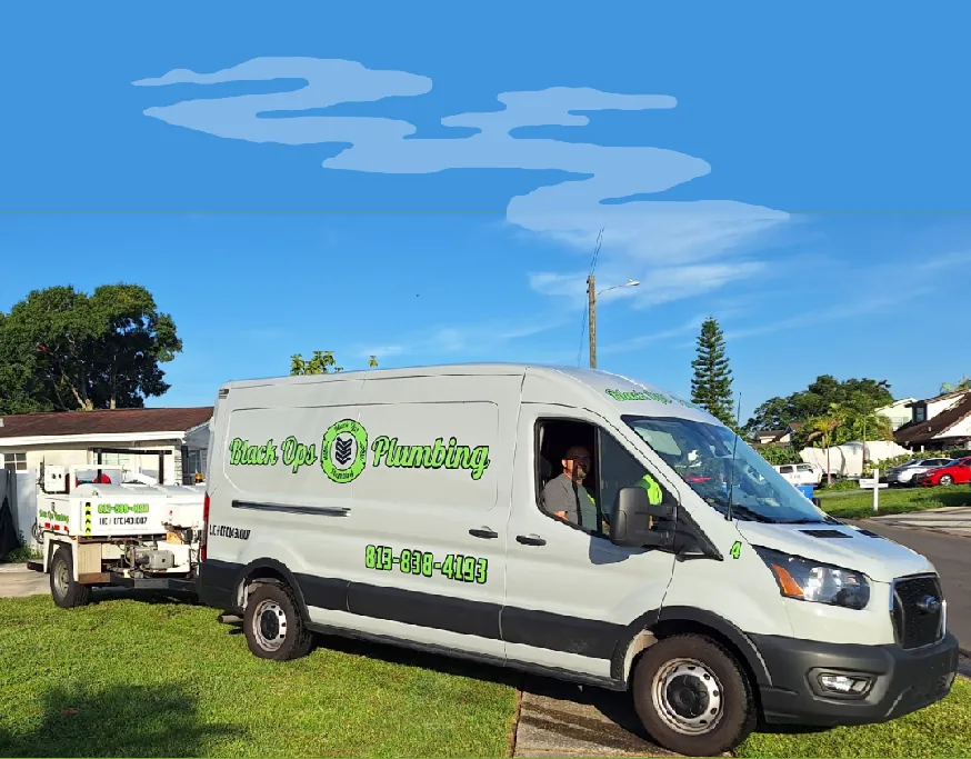 White Black Ops Plumbing van parked on grass with a small trailer attached under clear blue sky.