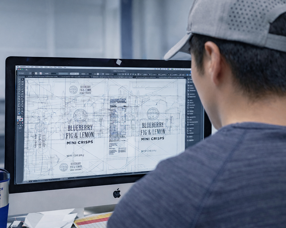An image of a man designing on a computer.
