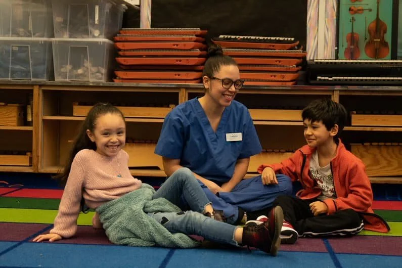 Counselor talking with two students