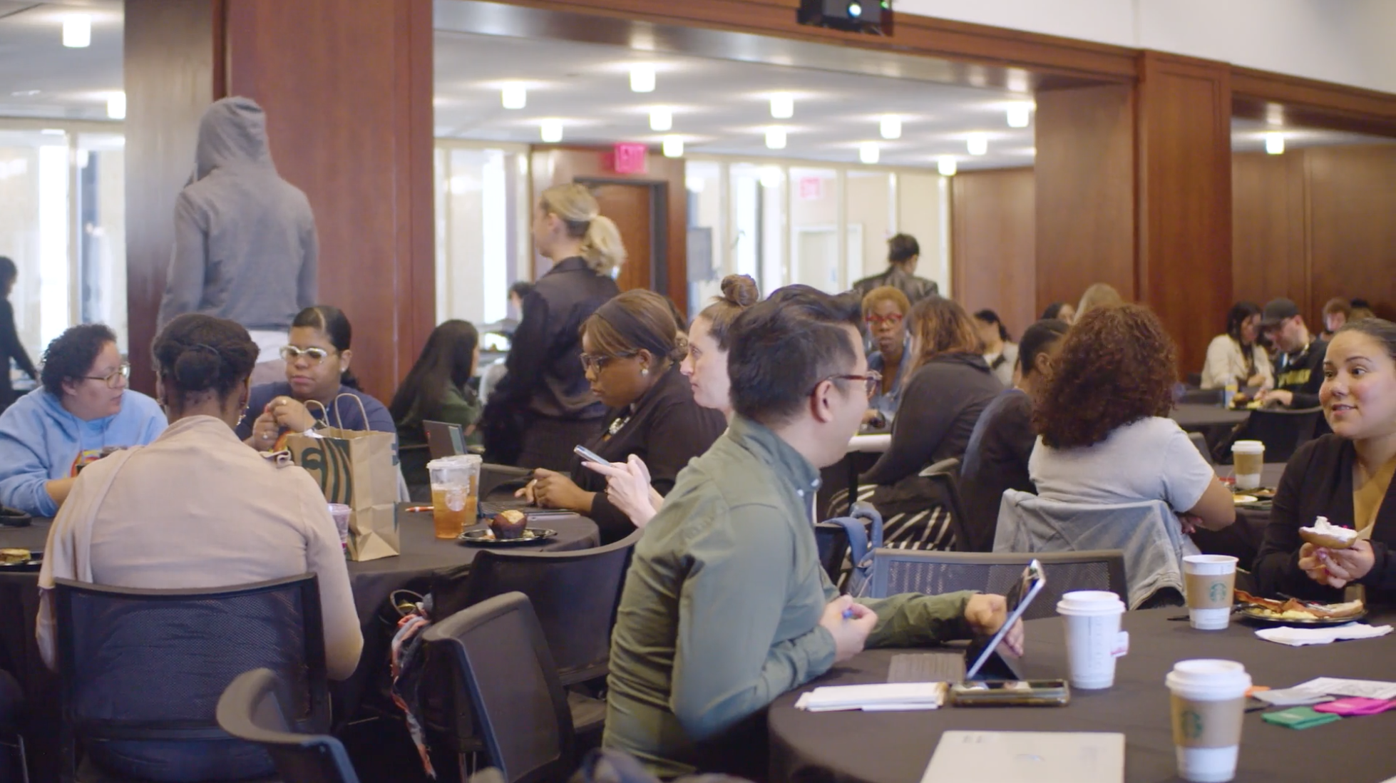 Attendees networking and dining at a school community event