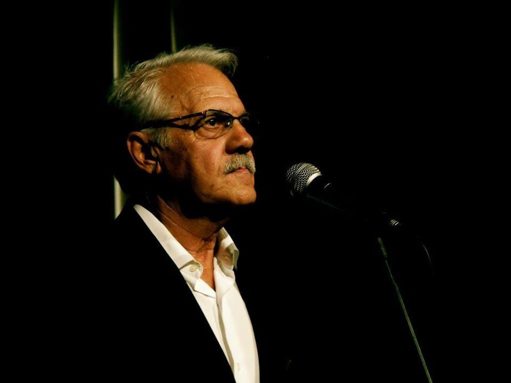 man with a suit in a dark background