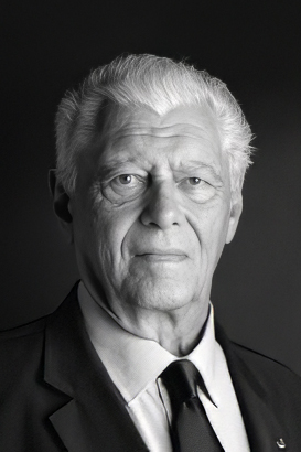 Elder me in suit on a dark background