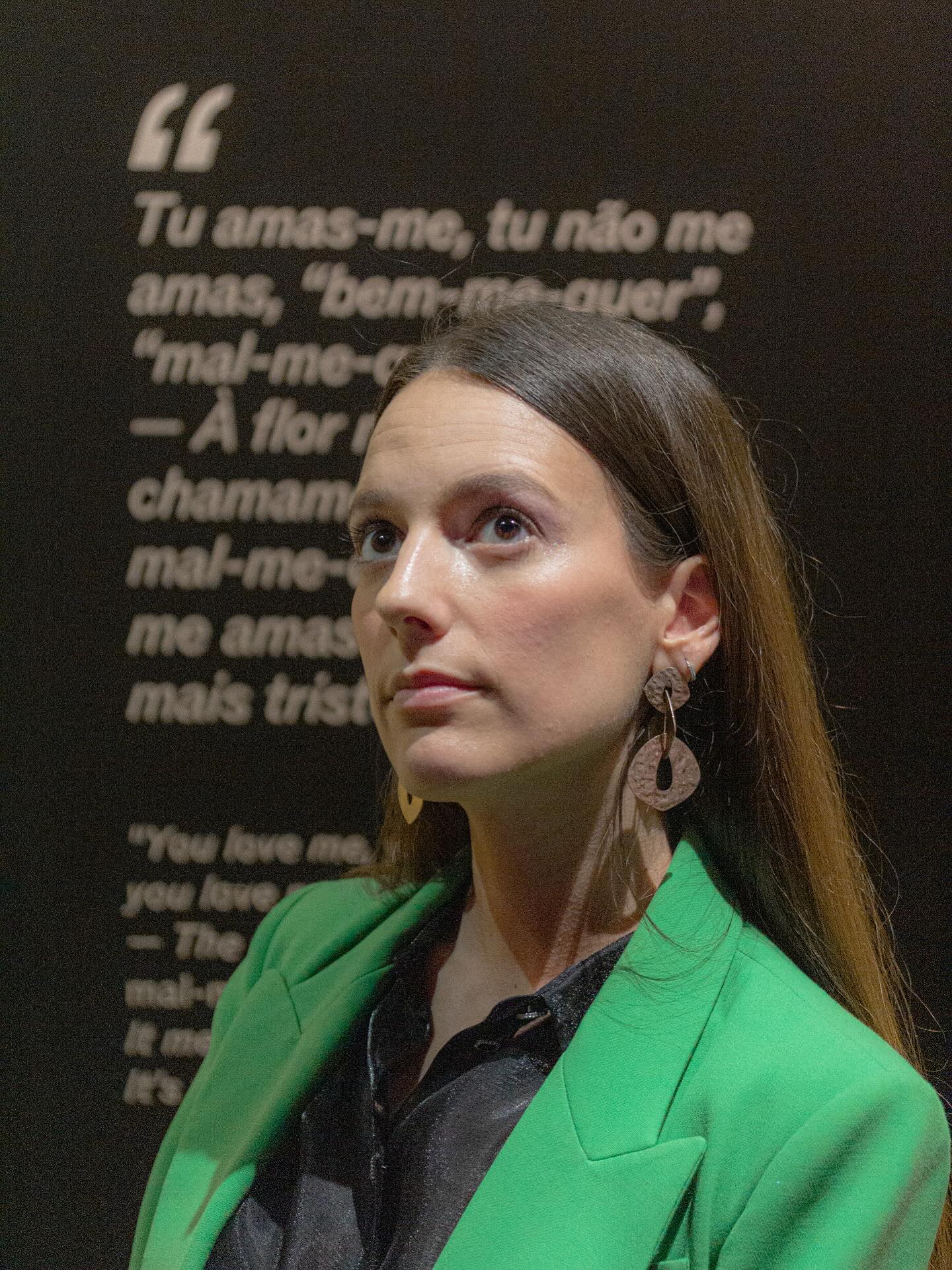 Woman in green jacket with a blurred background