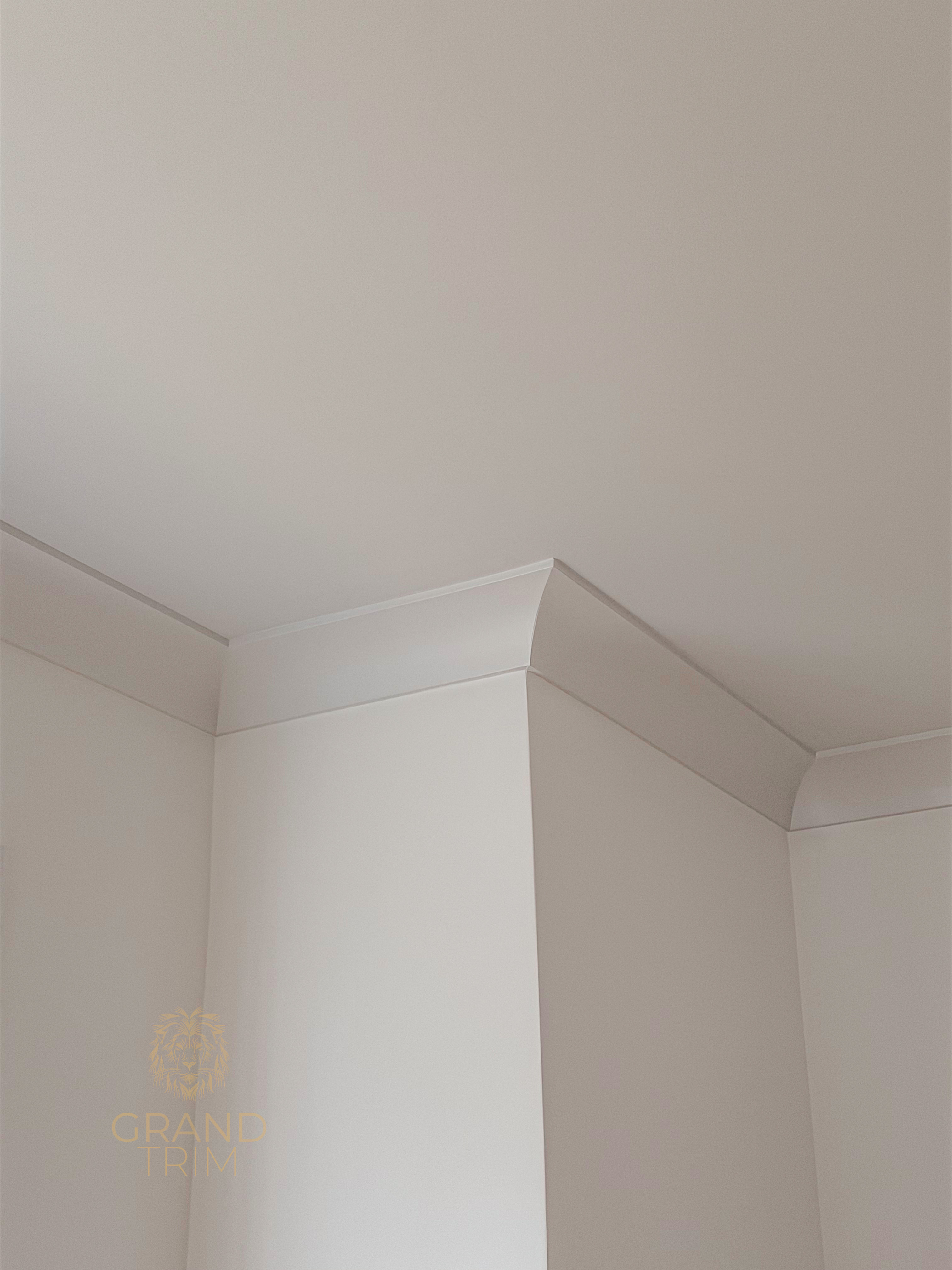 White crown molding installation at the wall-ceiling junction in a New Jersey home