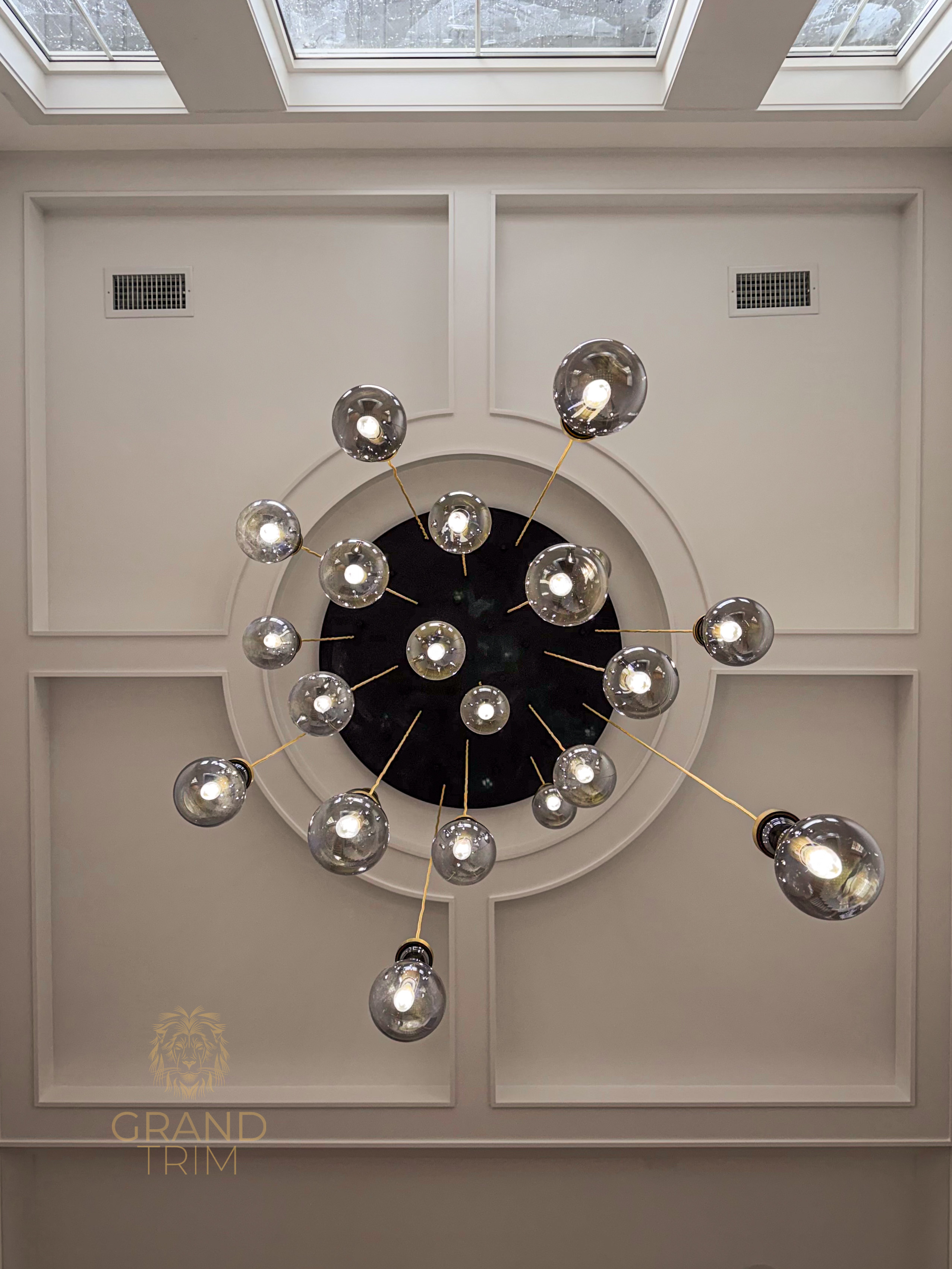 White coffered ceiling with a central decorative medallion and recessed panels in a modern New Jersey home