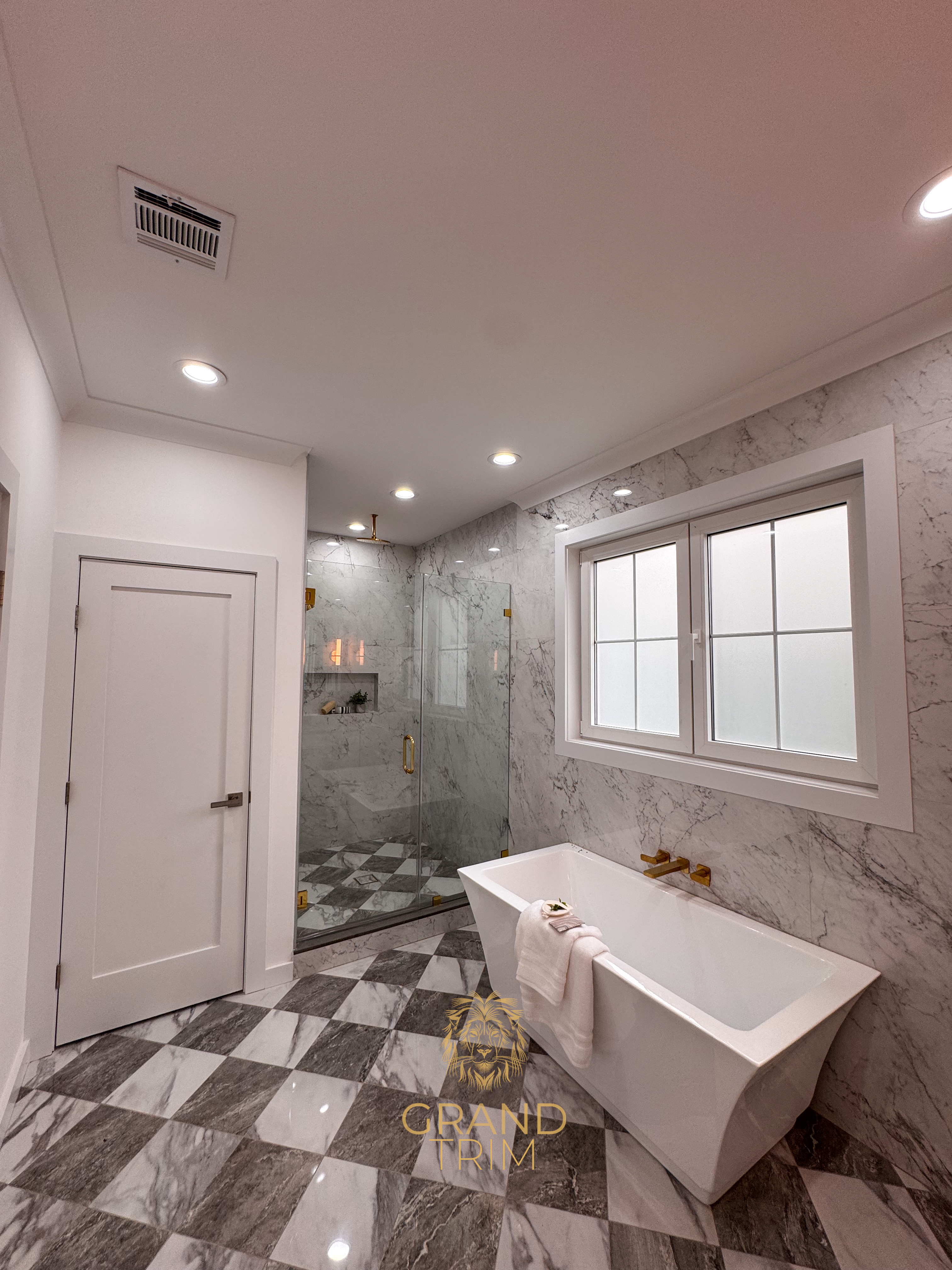 White crown molding, door, and window trim installation in a stylish New Jersey bathroom