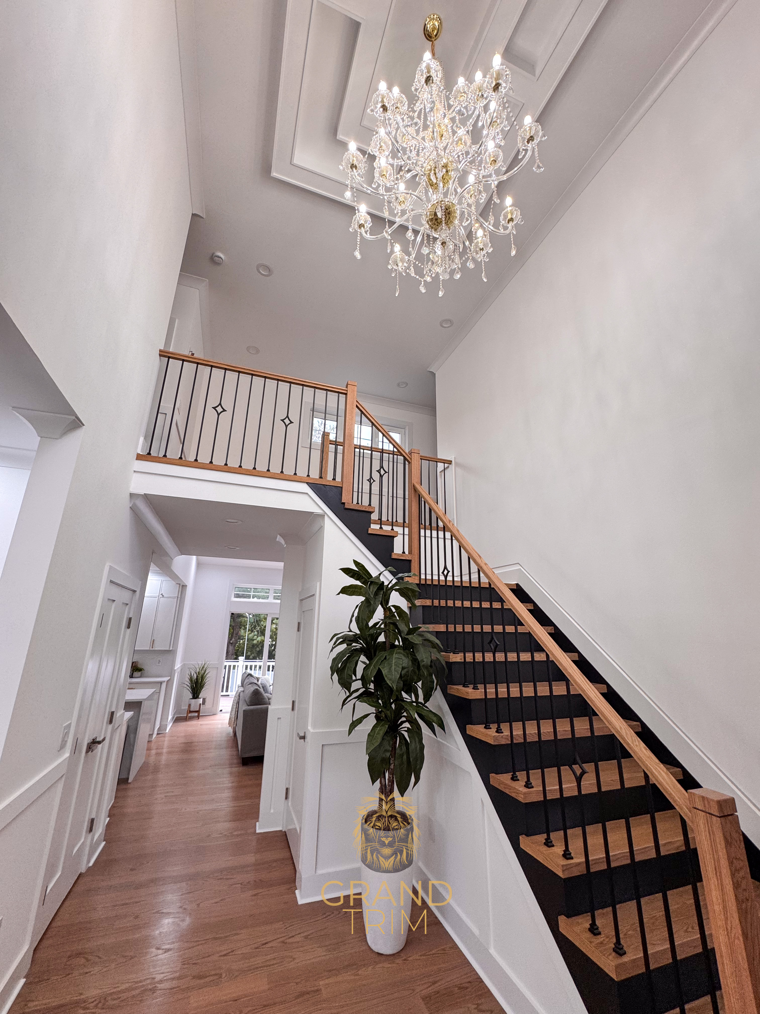 White tray ceiling with recessed panels and wainscoting wall paneling in a New Jersey entryway