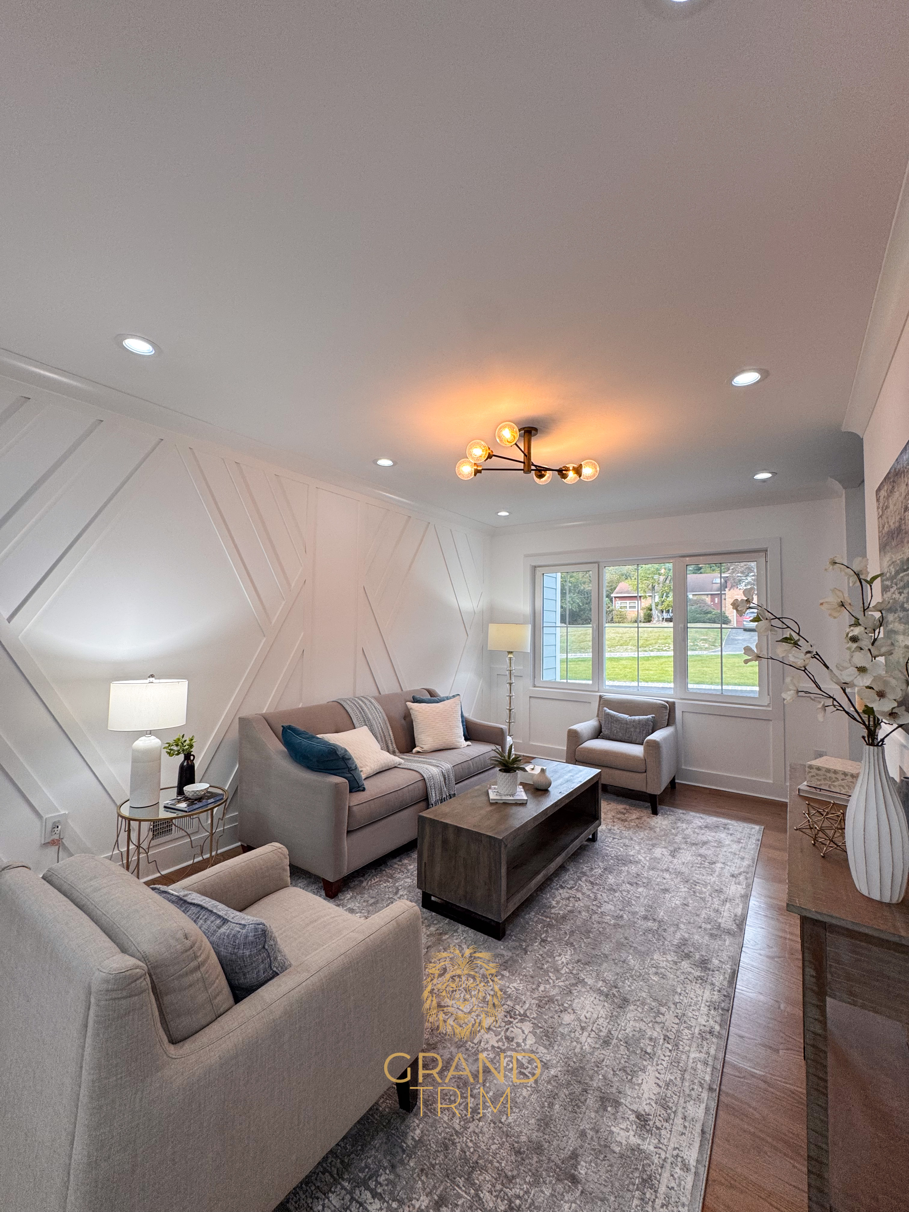 White diagonal wall paneling with crown molding in a modern living room in New Jersey