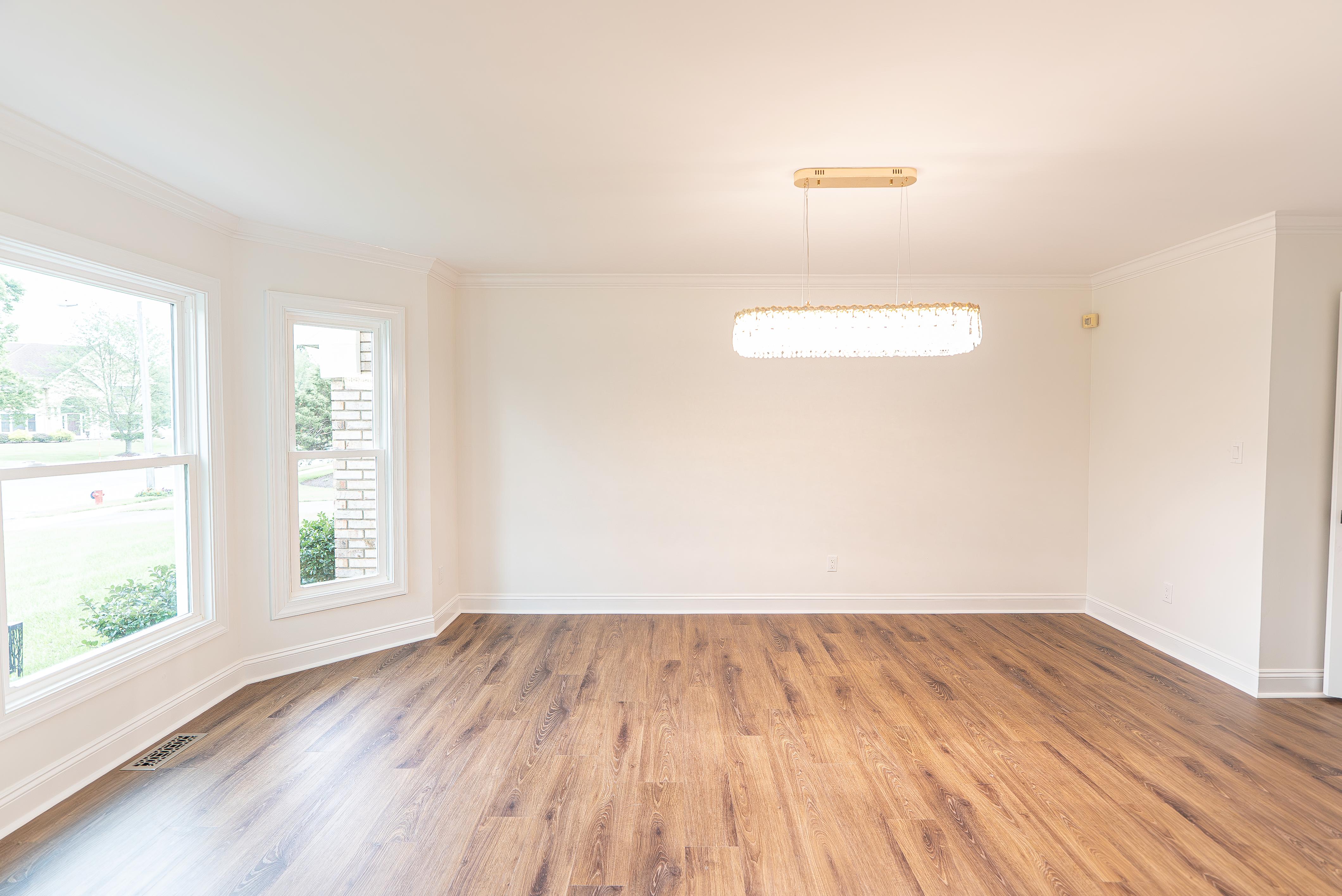 Crisp white crown molding and window trim in an unfurnished room in a a New Jersey home