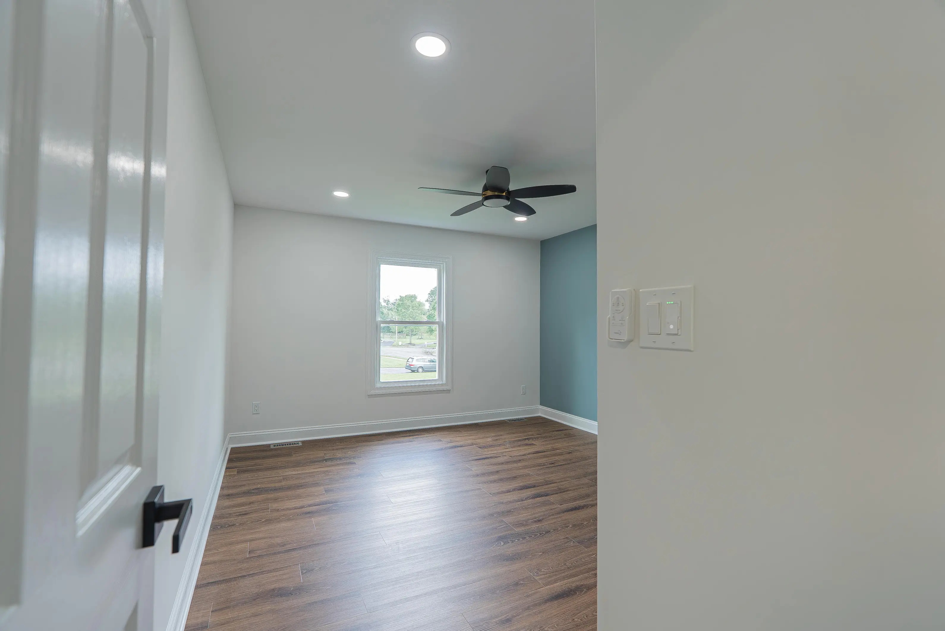 Newly installed white window trim and baseboards in an empty room in New Jersey