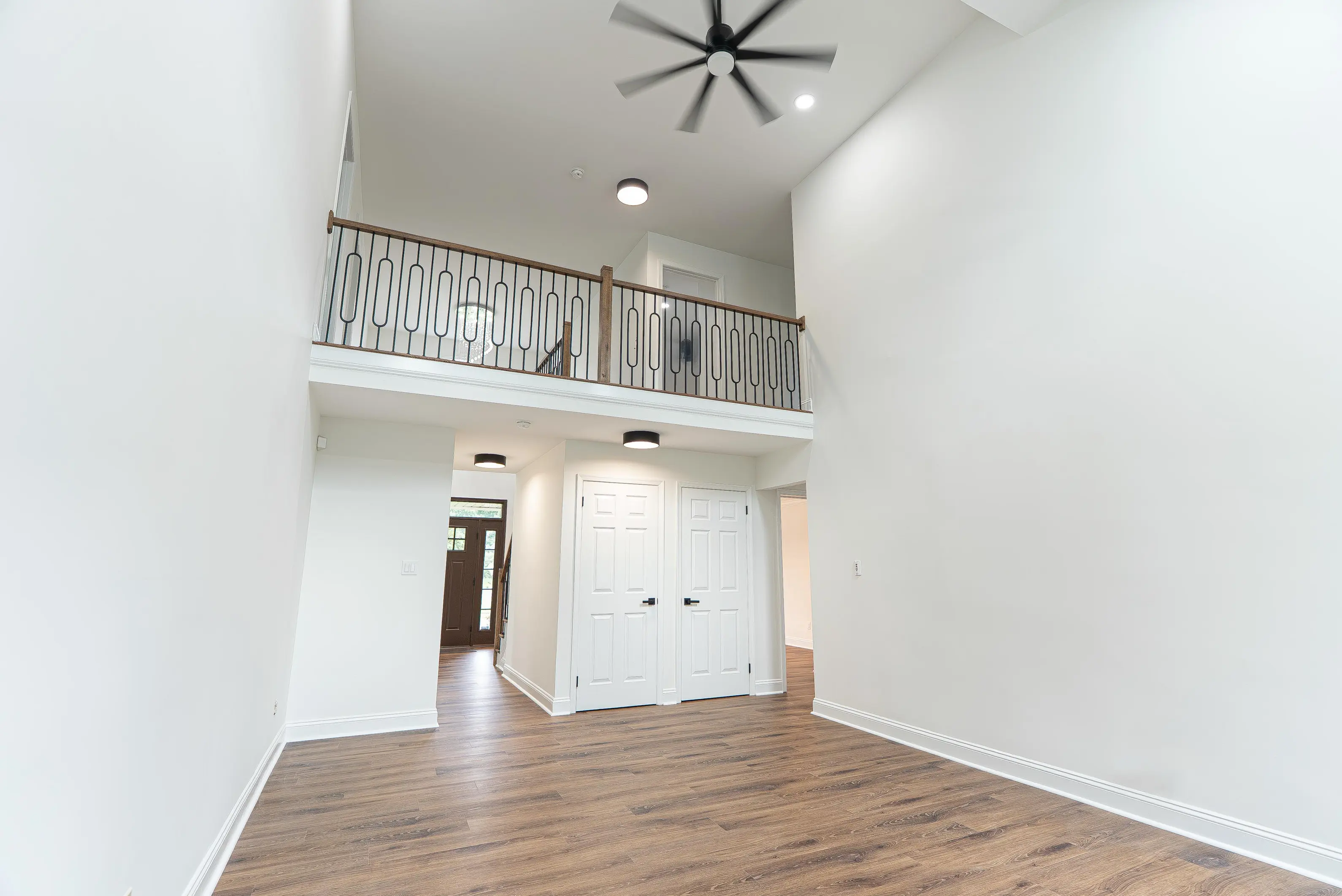 White trim and door casings in a spacious, two-story entryway in New Jersey