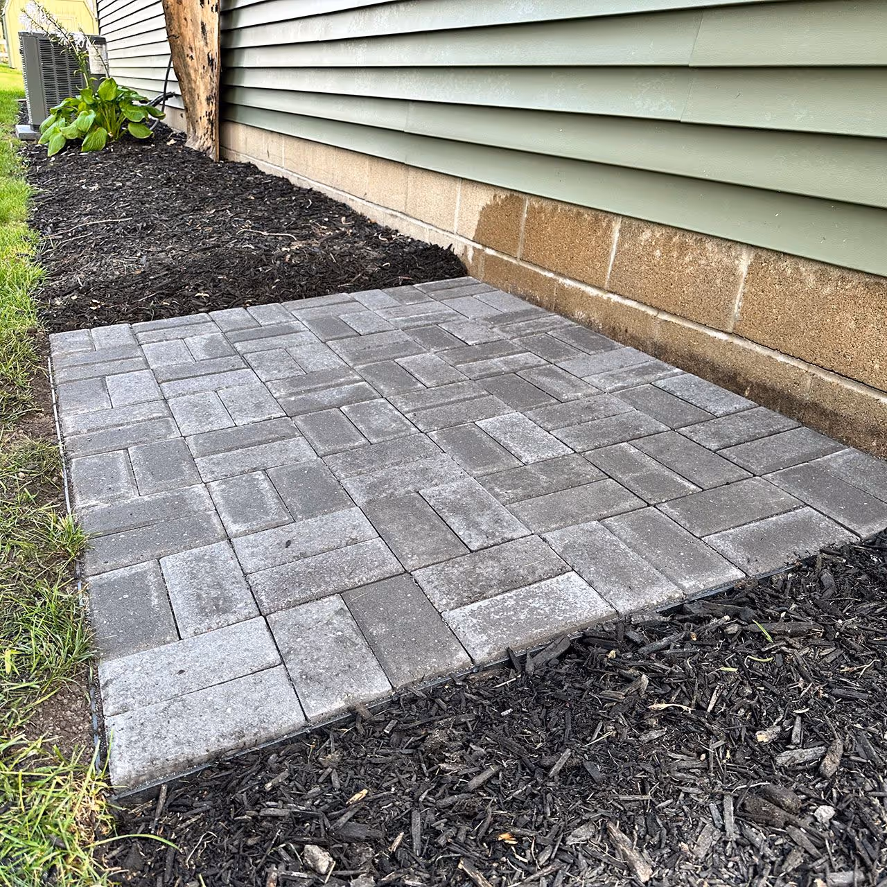 paver patio installation by Midwest Lawns LLC