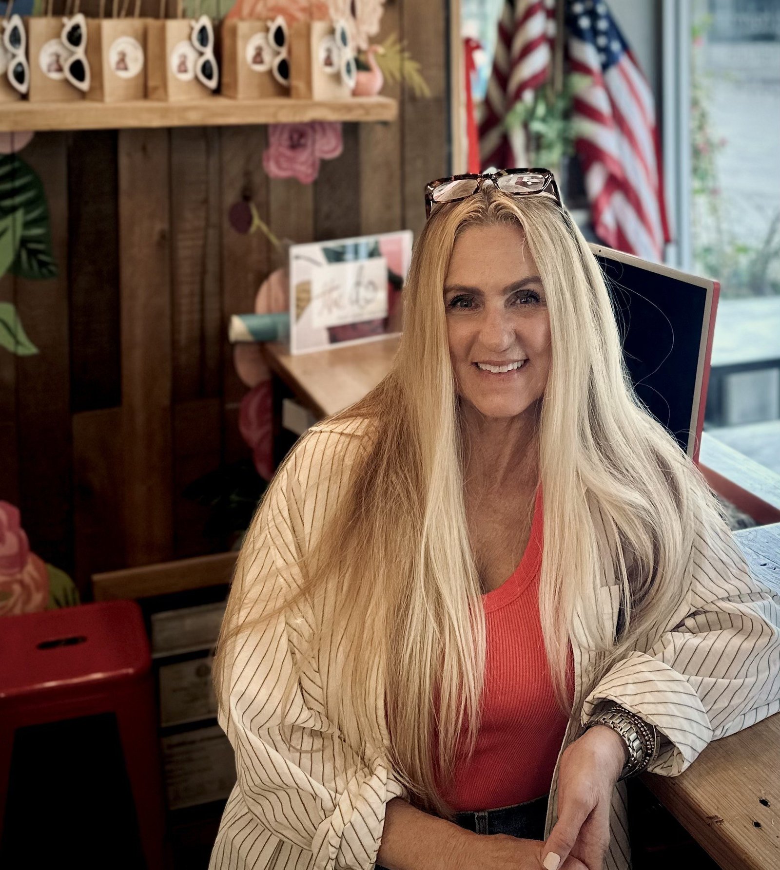 Bettyrae at the front desk of The Do Cut and Color in Dallas — aging well with great hair.