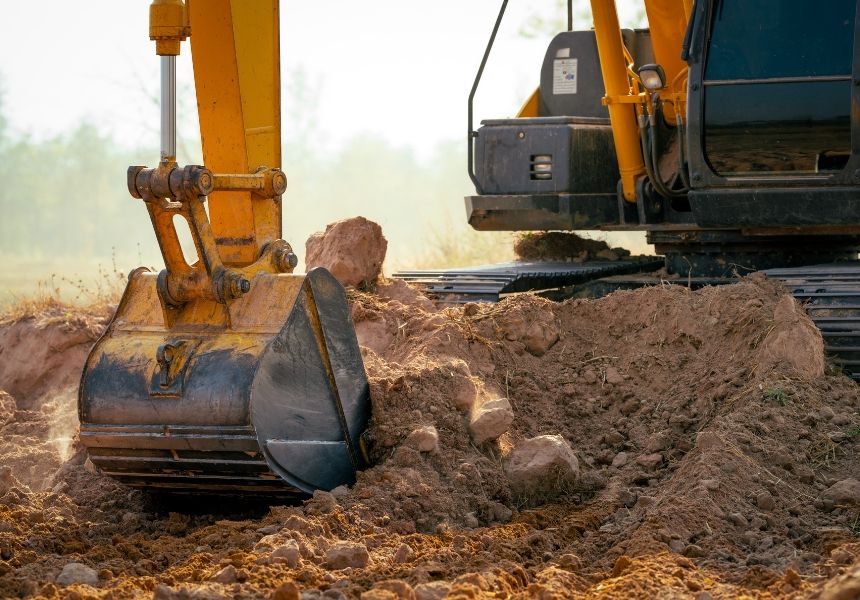 Mini excavator digging a trench