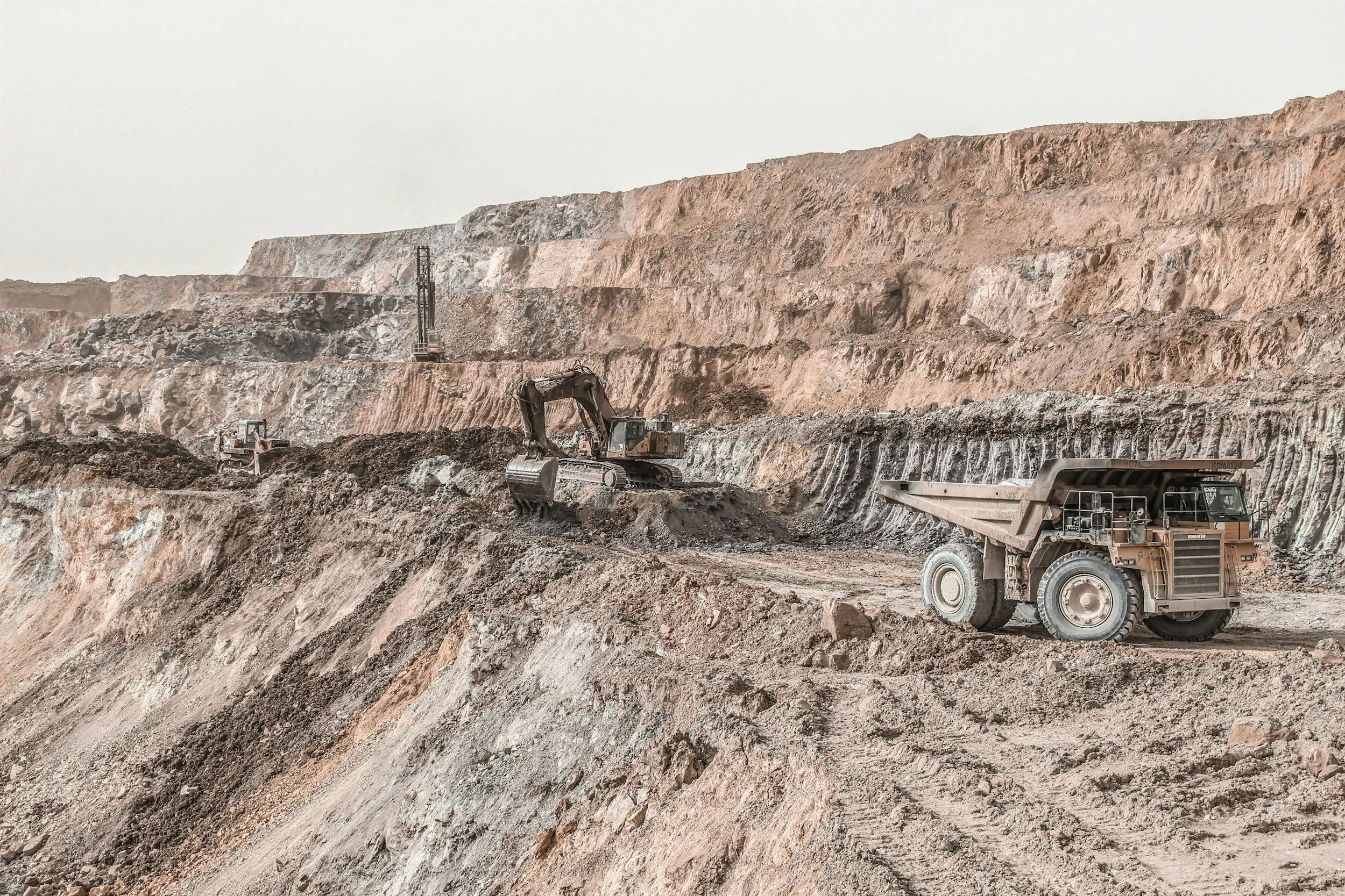 Excavators and heavy machinery operating in a mining site, showcasing Utah's historical significance in the mining industry.